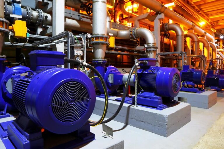 Technician repairing an industrial pump in Stoney Creek facility