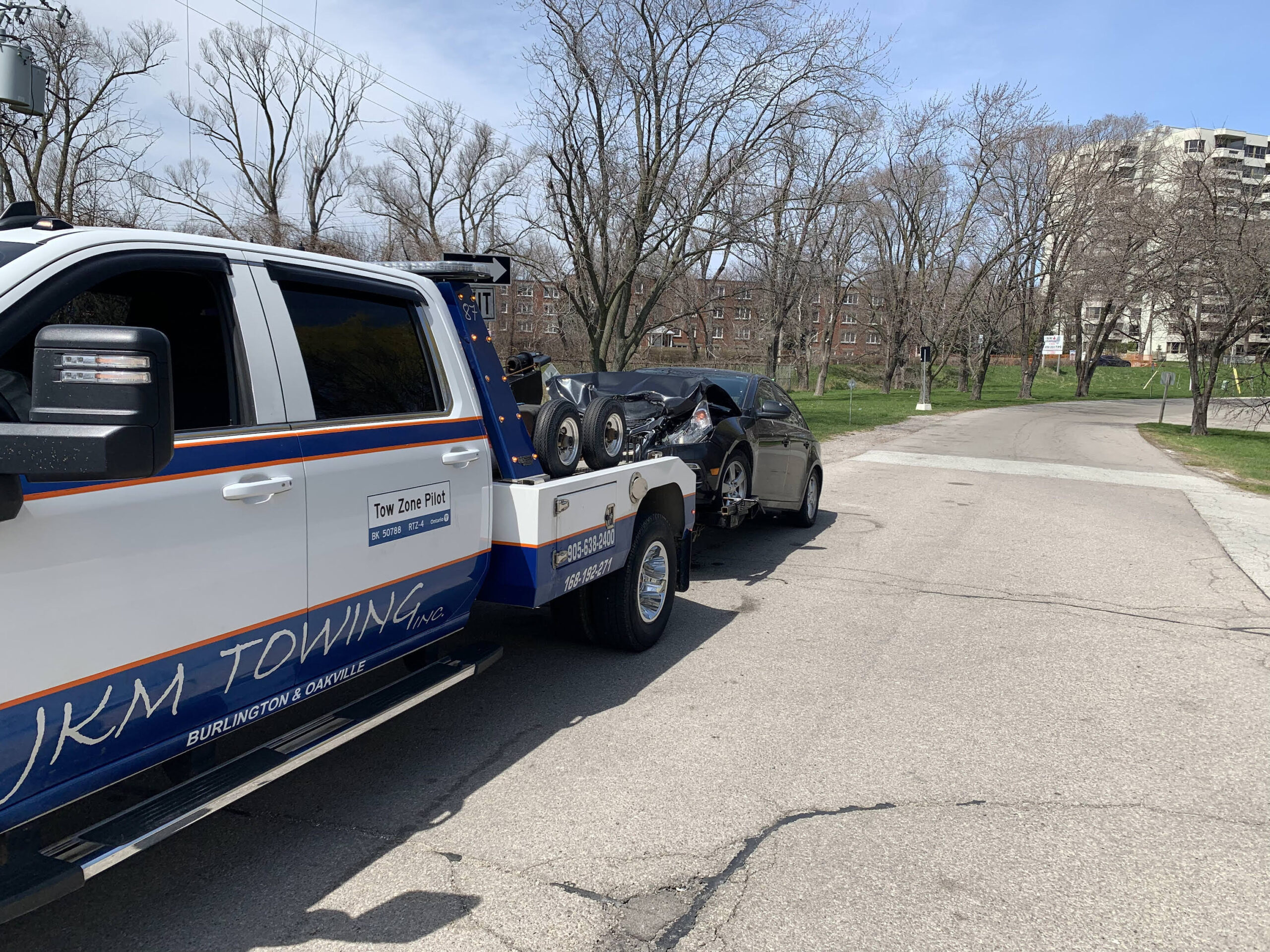 Tow truck assisting a vehicle on the roadside during an emergency