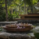 Wooden bowls with floating candles and flowers in a tranquil spa pool